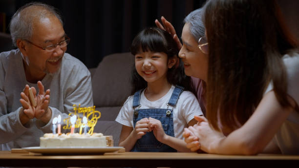 istock Family celebrating birthday with happiness 1472230164