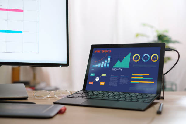 istock busienss martking plan on desktop and laptop computer screen working at home 1472236511