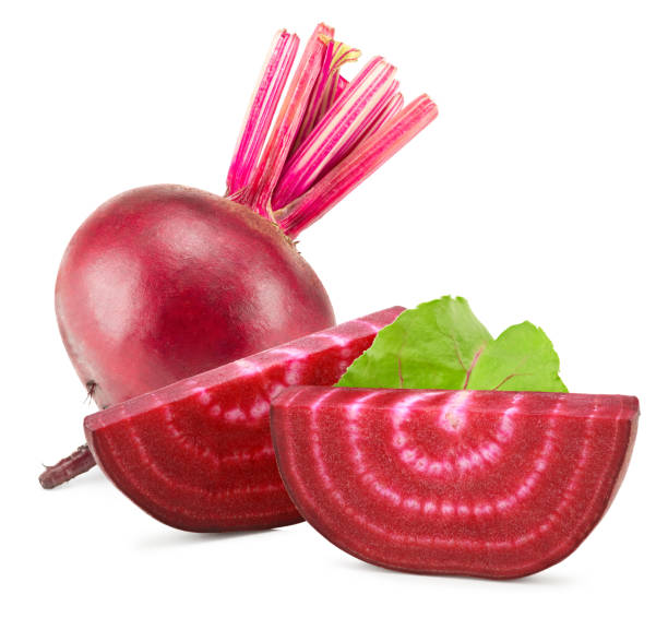 istock beetroot with pieces of beetroot and green leaf isolated on white background. clipping path 1472240740