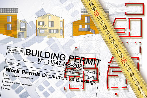Buildings Permit concept with residential building project against an imaginary floor plans and elevations project of a new building