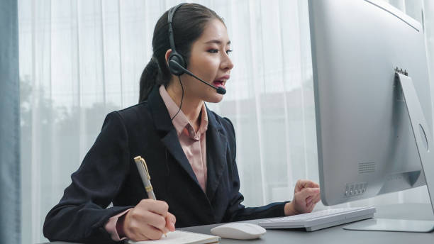 istock Enthusiastic female operator provide helpful customer service to customer. 1472242835