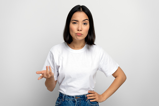 What do you want. Portrait of angry disgruntled girl asking who why make this conflict, looking with annoyed indignant expression. Studio shot isolated on white background