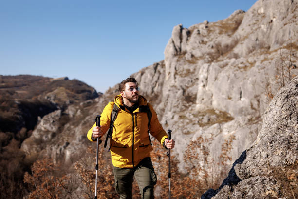 istock Male backpacker walking on mountain peak 1472244517