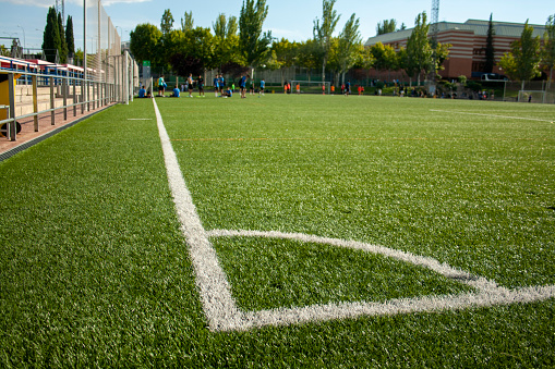 white lines on an artificial grass soccer field