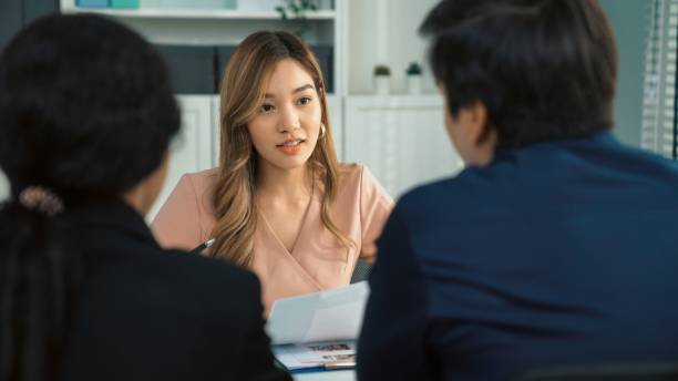 istock Young female asian candidate tries to impress interviewer by being competent. 1472247999