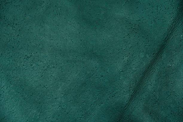 istock Green leather cut as background textured and wallpaper. Rustic style 1472248536