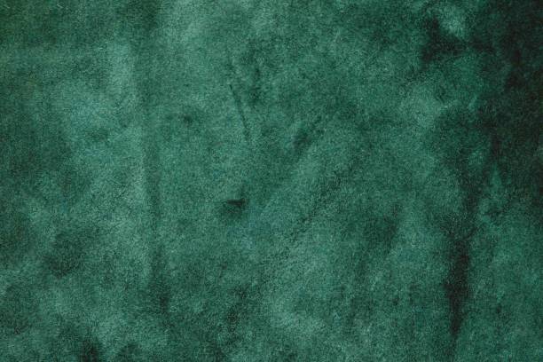 istock Green suede cut as background textured and wallpaper. Rustic style leather 1472249310