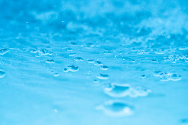 Background from a cosmetic product containing microgranules and air bubbles