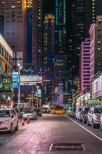 Night empty streets of new york, wet asphalt, skyscrapers
