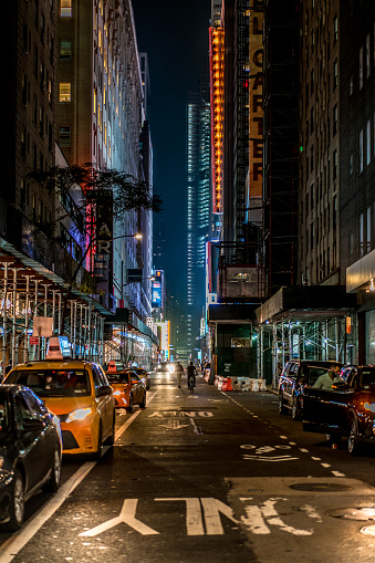 Night empty streets of new york, wet asphalt, skyscrapers