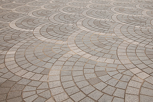 Gray pavement floor tiles, to the curved tiled floor, beautiful pattern background