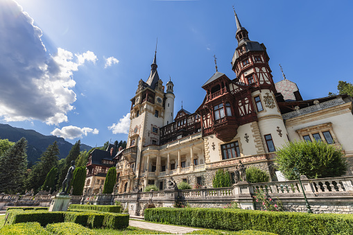 Panoramic picture of the beautiful Peles Castle and its beautiful gardens near Sinaia, Romania