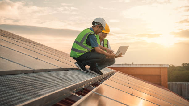 istock Service engineer checking solar cell on the roof for maintenance if there is a damaged part. Engineer worker install solar panel. Clean energy concept. 1472254967