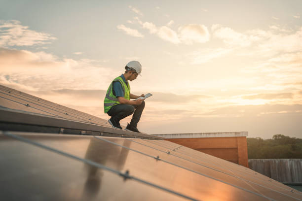 istock Service engineer checking solar cell on the roof for maintenance if there is a damaged part. Engineer worker install solar panel. Clean energy concept. 1472255227