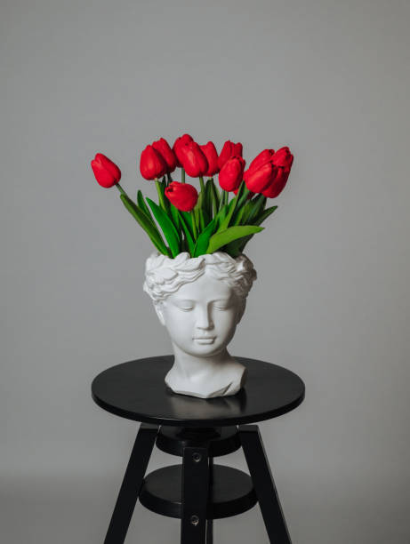 istock a bouquet of red tulips on a white background 1472255590