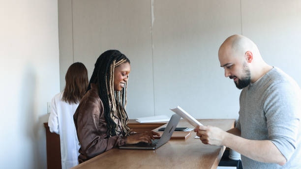 istock Healthcare Administrator and Patient Chatting 1472256502