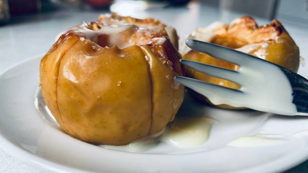 istock Image of baked apple dessert with cream sauce 1472256530