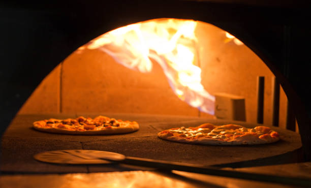 istock Pizza in a wooden oven 1472259348