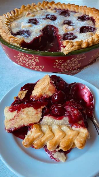 istock Image of a shortbread pie with cherry filling during cooking 1472259395