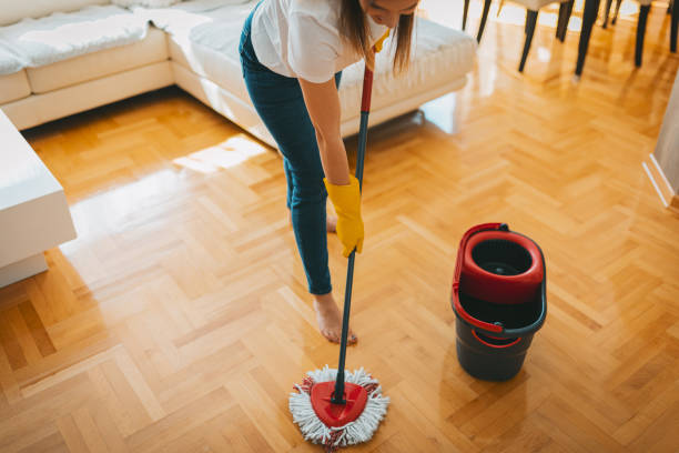 istock A cleaning woman mopping a parquet floor 1472262819