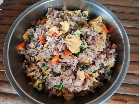 Cooking Fried Rice in cooking pan - food preparation.