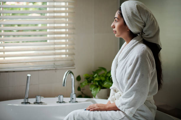 istock Woman in Bathrobe and Towel on Head 1472263983