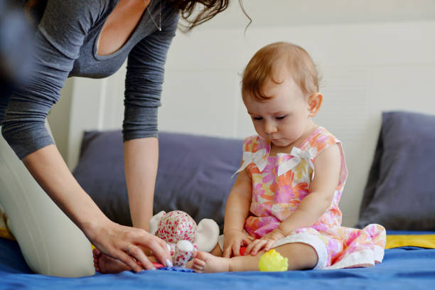 istock Mother Playing with Baby 1472264494