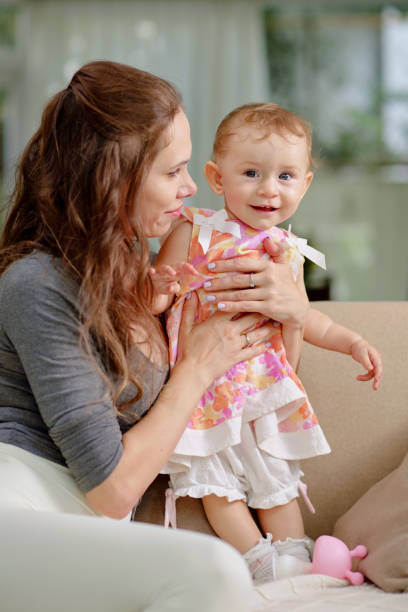istock Mother Playing with Little Daughter 1472264571