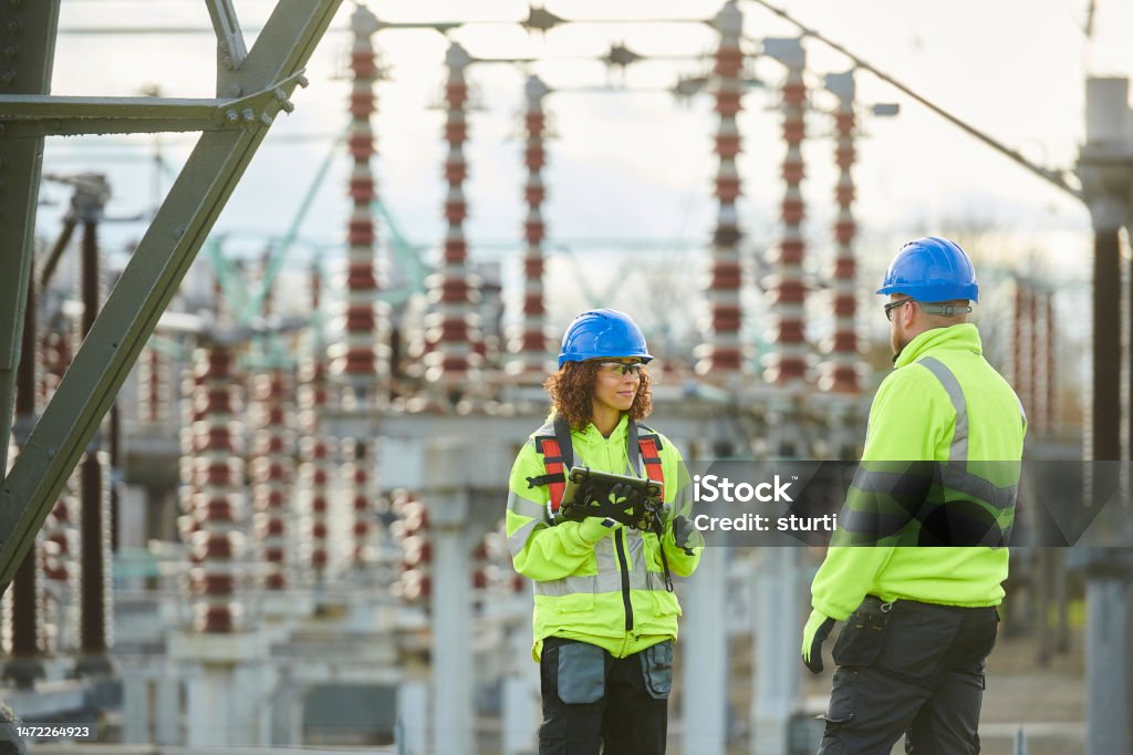 substation power worker Fuel and Power Generation Stock Photo