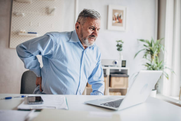 istock Overtime in the office, back pain 1472266175