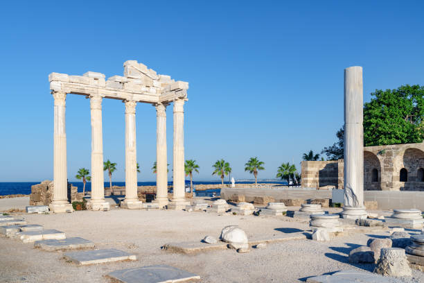 Awesome ruins of the Temple of Apollo in Side, Turkey Awesome ruins of the Temple of Apollo on the Mediterranean Sea coast in Side, Turkey. The Roman temple is a popular tourist attraction in Turkey. Amazing view of columns on sunny day. temple of apollo antalya province stock pictures, royalty-free photos & images