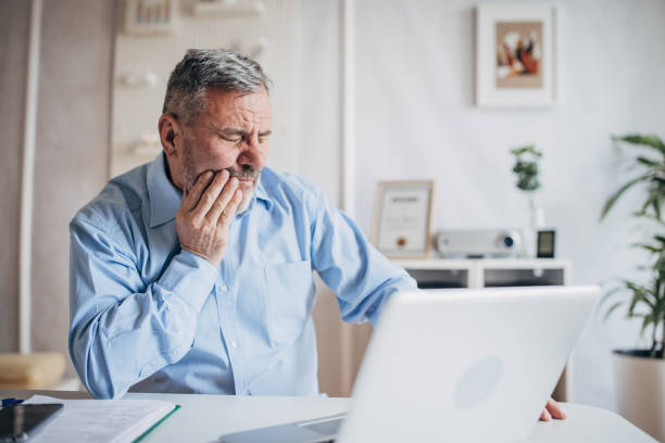 istock Toothache of an elderly man 1472267293