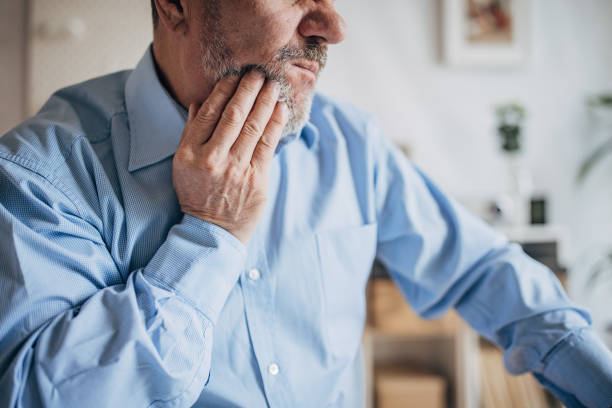 istock Toothache of an elderly businessman 1472267294