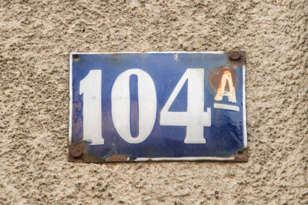 istock Weathered grunge plate address with number 104 1472267630