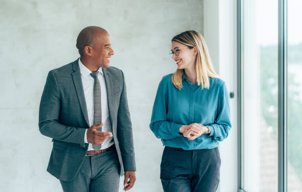 istock Two cheerful business people 1472269619