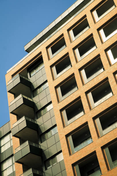istock Low angle view of a modern red brick building. 1472270777