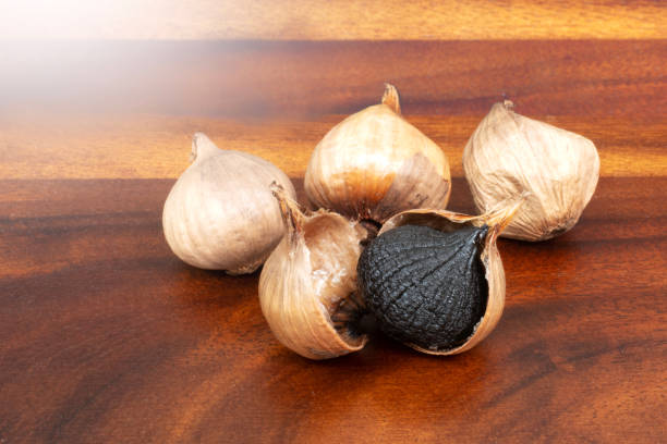 istock Black Garlic in Nature Background. 1472274669