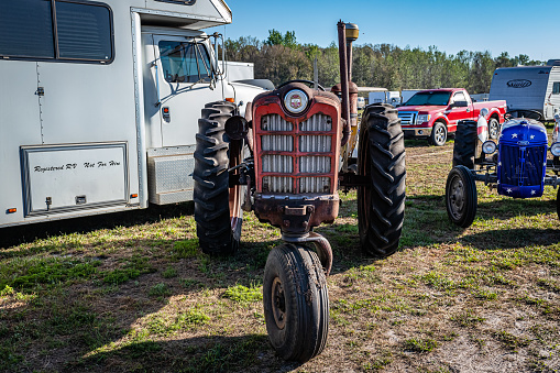 Fort Meade, FL - February 26, 2022: High perspective front view of a 1959 Ford 961 Diesel Tractor at a local tractor show.