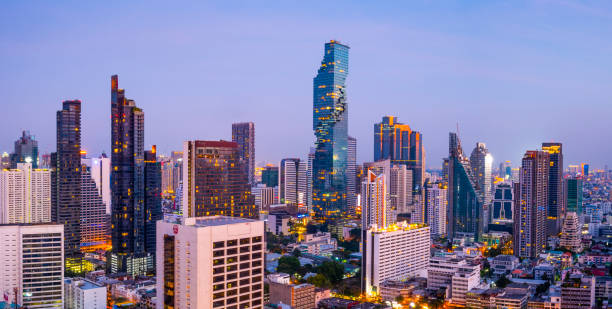 Aerial View of the Silom District of Bangkok City Skyline at Sunset, Thailand stock photo