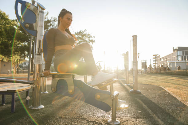 Young fitness coach advises the use of outdoor fitness devices, especially pedal exerciser as it is a great way to improve joint health for those with knee pain and knee arthritis