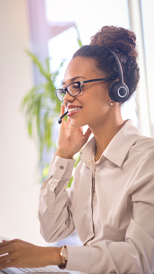 Customer service, consulting profile and happy black woman telemarketing on contact us CRM or telecom. Call center communication, online e commerce or information technology consultant on microphone
