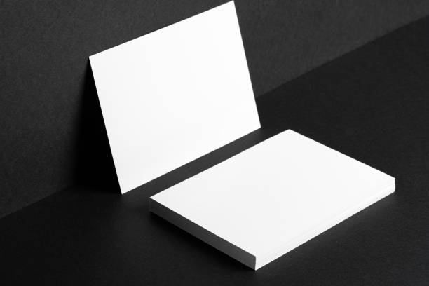 istock White businesscards on black background close up 1472288506