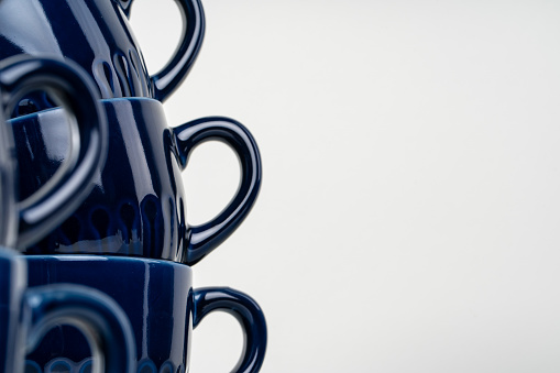 Simple ceramic blue crockery on kitchen counter. Tableware