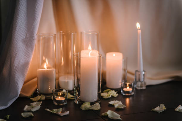 istock Festive table covered tablecloth, decorated composition flowers and candles in party area. Wedding setup detail. Table setting, serving closeup. Banquet decoration in hall restaurant. Luxury reception. 1472290854