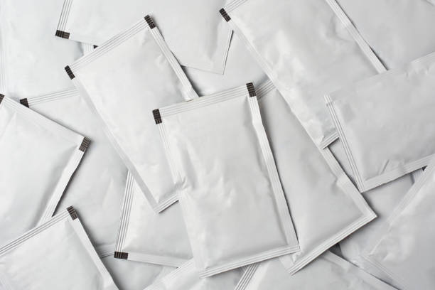 istock pile of blank white sachet packets full frame 1472293524