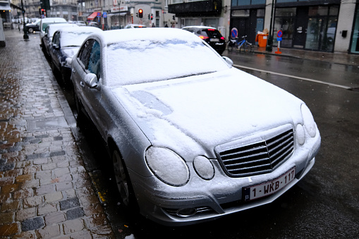 Cars seen in the street during a snowfall in city of Brussels, Belgium on March 8, 2023