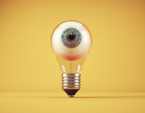 Eye inside a light bulb. Vision concept. This is a 3d render illustration