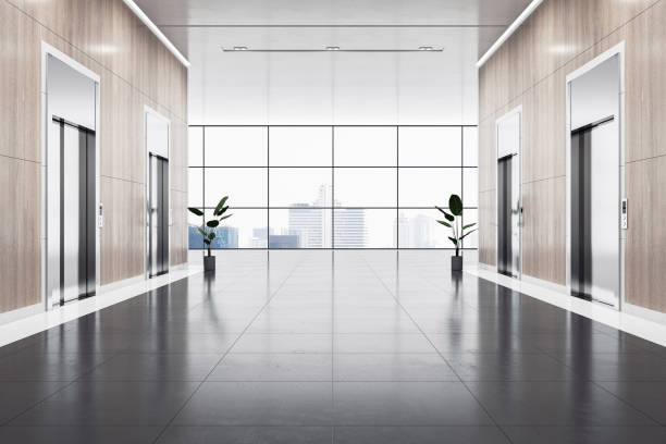 Empty spacious business center corridor with wooden walls and place for product presentation on dark floor between elevators on city view background from panoramic window. 3D rendering, mockup stock photo