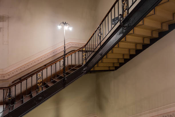 Vintage victorian staircase in government building with lighting