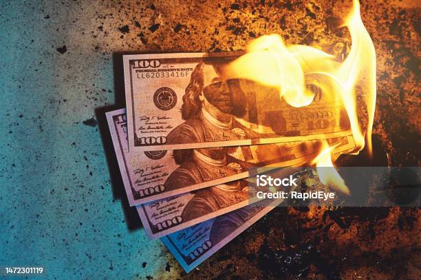 Three 100 Banknotes Burning Amid Fire Flames And Ash Stock Photo - Download Image Now